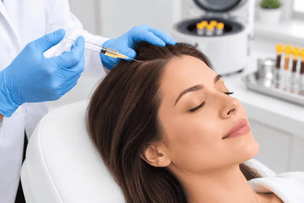 A woman receiving a PRP hair restoration scalp treatment at SeaMist MedSpa in Newport and South Kingstown, RI.